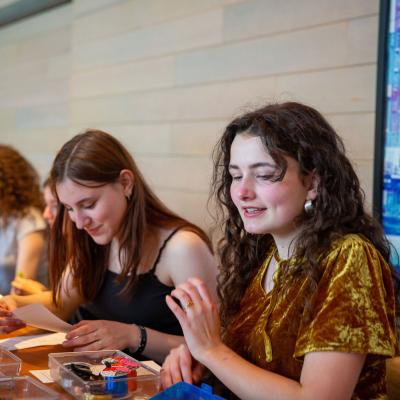 image of young people making art and smiling